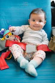 Happy Baby Girl Sitting On A Plane Seat