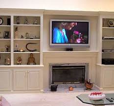Bookcases And Fireplace With Plasma Tv
