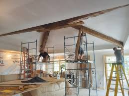 hand hewn beams to a finished ceiling