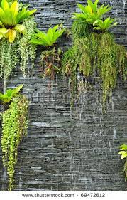 A Waterfall On The Stone Wall With The