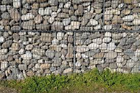 Stone Textured Fence On Green Lawn Made