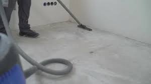 A Worker Is Cleaning The Concrete Floor