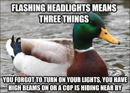 flashing headlights means three things