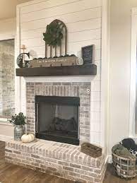 Shiplap Fireplace With Brick Surround