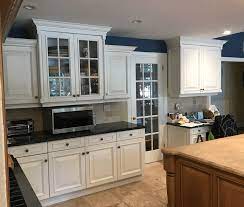 White Kitchen Cabinets Paired With Navy