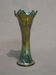 A Green Carnival Glass Vase With Wavy