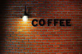 Coffee Signage On Brown Concrete Wall