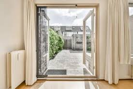 Balcony Door Overlooking Green Trees
