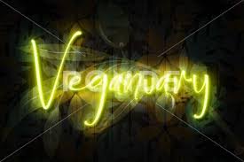 Veganuary Neon Sign On A Dark Plant