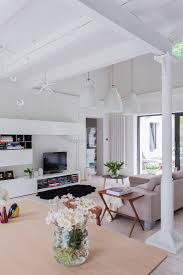 bright living room with ceiling beams