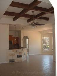 a coffered ceiling with beams