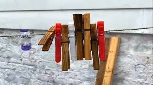 Closeup Of Clothes Pins Swaying In Wind
