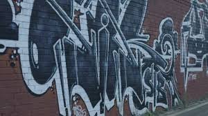 Graffiti Pan On Brick Wall Stock