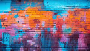 Brick Wall With A Colorful Graffiti