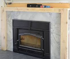 A Brick Fireplace With Wood Stone