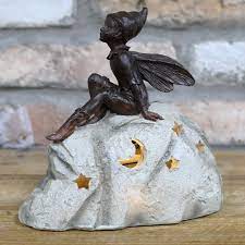 A Fairy Figure On A Stone Solar Powered