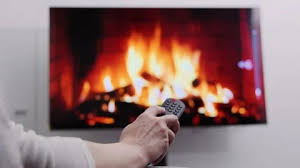 A Woman Holding Remote Control In Front
