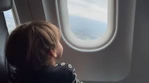 Small Child Traveling By Plane Little