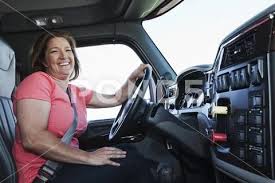 Caucasian Woman Driver In The Cab Of A