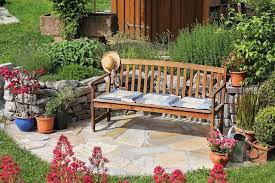 A Cushioned Wooden Garden Bench Resting