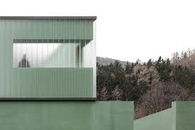 Recycled Green Glass Panels Encase This