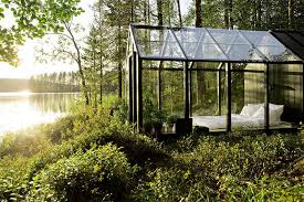 Glass Enclosed Bedroom Beside A Lake