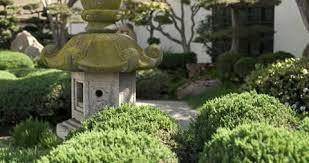 A Japanese Garden And A Stone Lantern