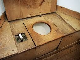 Open Lid Of Brown Wooden Toilet Seat