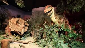 Tropical Garden With Dinosaur Sculpture