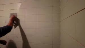 Builder Grouting Ceramic Tiles On