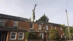 25ft Shark Sticking Out Of Roof Banned