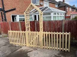 Garden Arch With A Gate And Side Picket