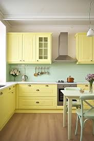 A Kitchen With Yellow Paint Cabinets