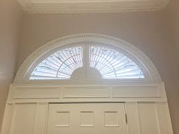 Large Arch Shutters Above Front Doors