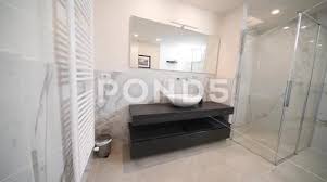 Spacious Bathroom In Gray Tones With