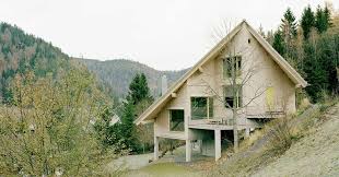 Amunt Forms Wooden House On A Hill In