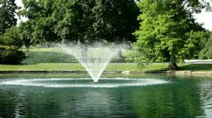 Water Fountain In Park Pond Stock