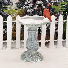 Stone Bird Bath With Red Bird And Snow