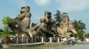 Giant Humanoid Statues Holding Fish