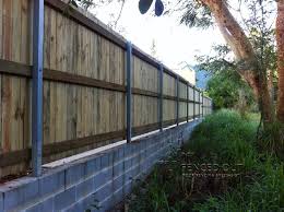 Timber Fence With Retaining Wall