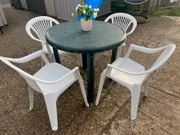 Green Plastic Table And 4 Stacking