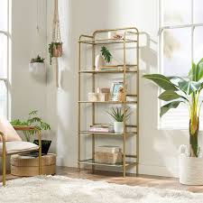 A Glass And Gold Wire Bookcase As A