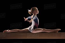 gymnast on balance beam stock photo