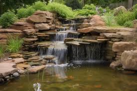 Waterfall Cascading Into Backyard Pond