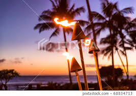 Hawaii Sunset With Fire Torches