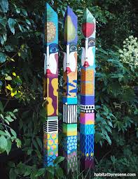 Garden With These Colourful Totem Poles