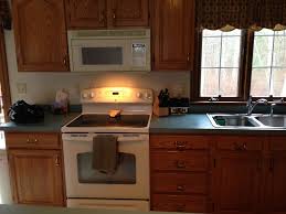 Oak Cabinets And Blue Green Countertops