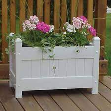 The most common white planter box material is wood. Dura Trel 28 In W X 19 In H White Pvc Vinyl Planter Lowes Com Large Planter Boxes Planter Boxes Large Outdoor Planters