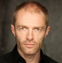 Welsh. Actor, menacing low notes to high humour.