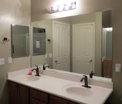 Several options to install them are at each side of the mirror or above it. How To Frame A Mirror Diy Bathroom Mirror Frames Tutorial A Mom S Take